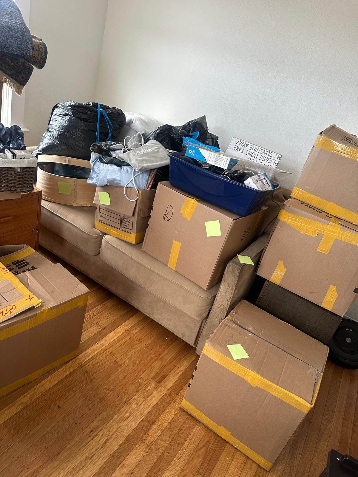 Boxes and household belongings ready for a home cleanout | Divas Junk Removal Services Boxes and household belongings ready for a home cleanout